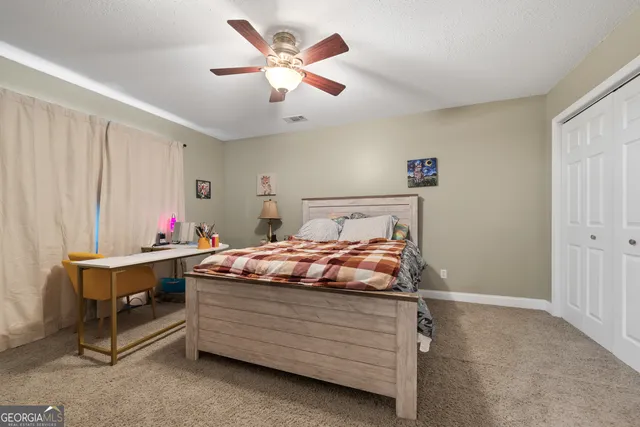 a bed room with a bed and a chandelier