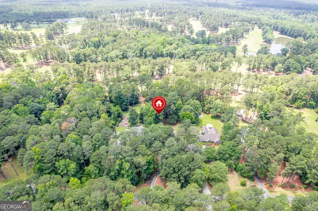a close up of a house with a yard and plants