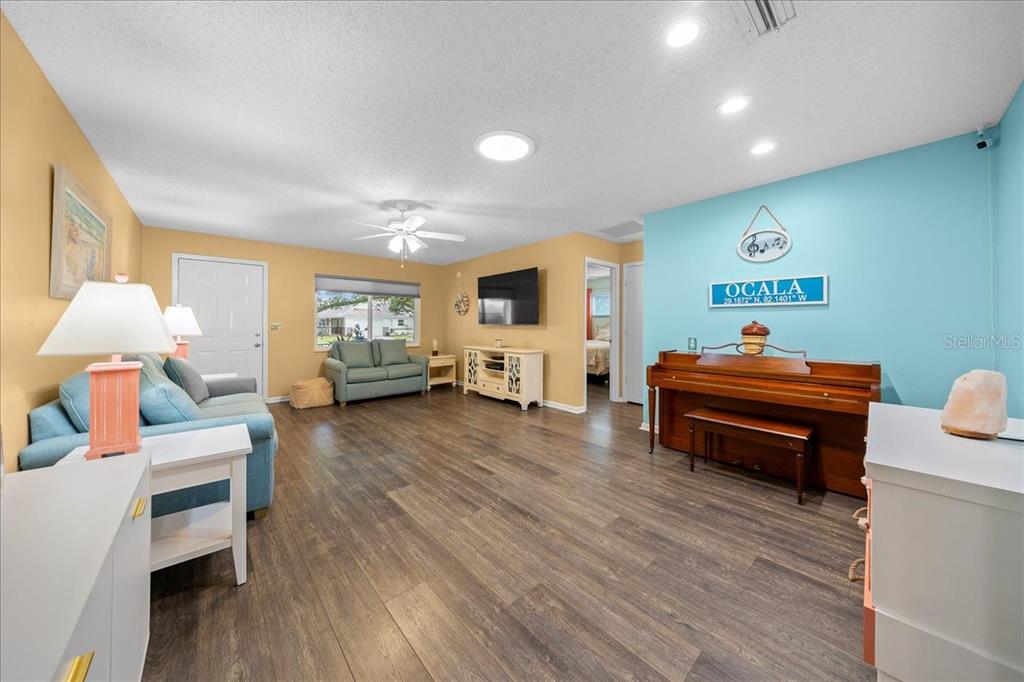 8720 Southwest 90th Street, Unit A Ocala, FL 34481 - Photo 11 of 71 a living room with furniture and a wooden floor