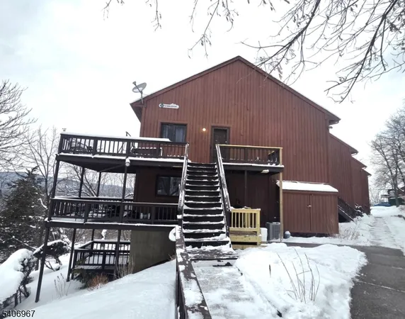 a front view of a house with stairs