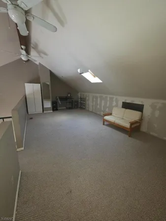 a living room with furniture and a projector