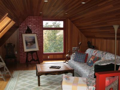 Undisclosed Address Falmouth, MA 02540 - Photo 10 of 13 a living room with furniture a window and a fireplace