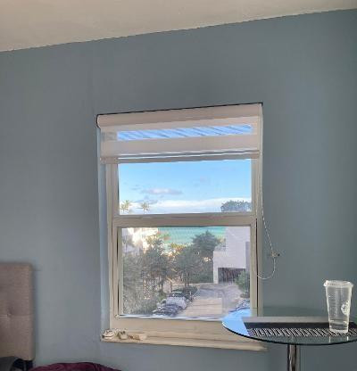 3000 Riomar Street, Unit 710 Fort Lauderdale, FL 33304 - Photo 10 of 12 IMPACT WINDOW, OCEAN VIEW FROM BEDROOM