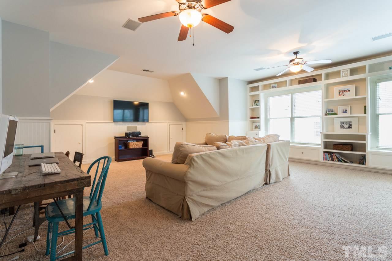3215 Rain Forrest Way Raleigh, NC 27614 - Photo 22 of 30 Built in Bookcases, Ceiling Fan and Access to Back Staircase