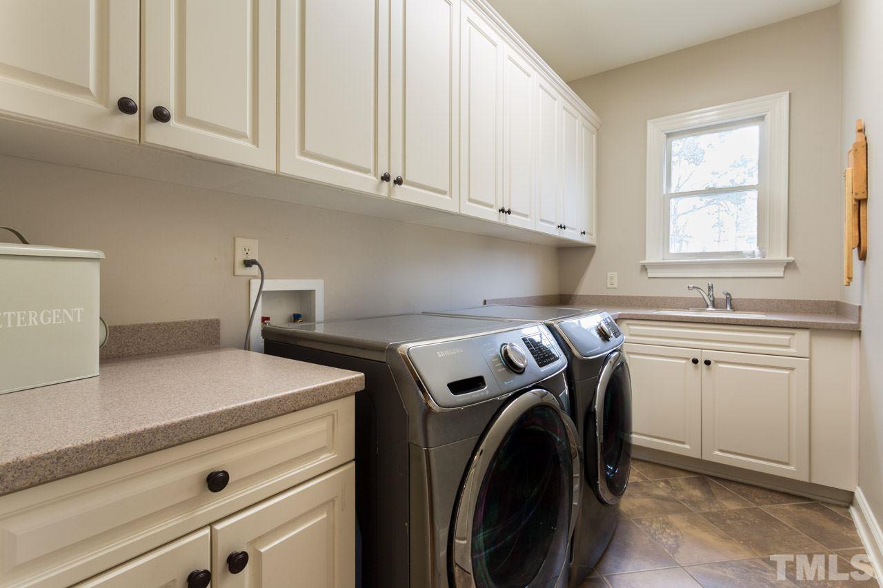 3215 Rain Forrest Way Raleigh, NC 27614 - Photo 23 of 30 Utility Sink and Multiple Cabinets for Storage