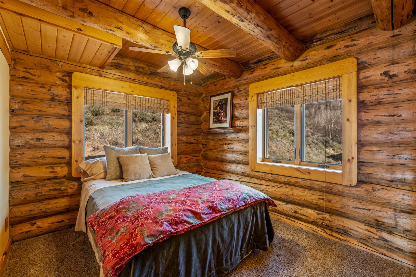 24110 Arapahoe Road Oak Creek, CO 80467 - Photo 22 of 39 a bed sitting in a bedroom next to a window
