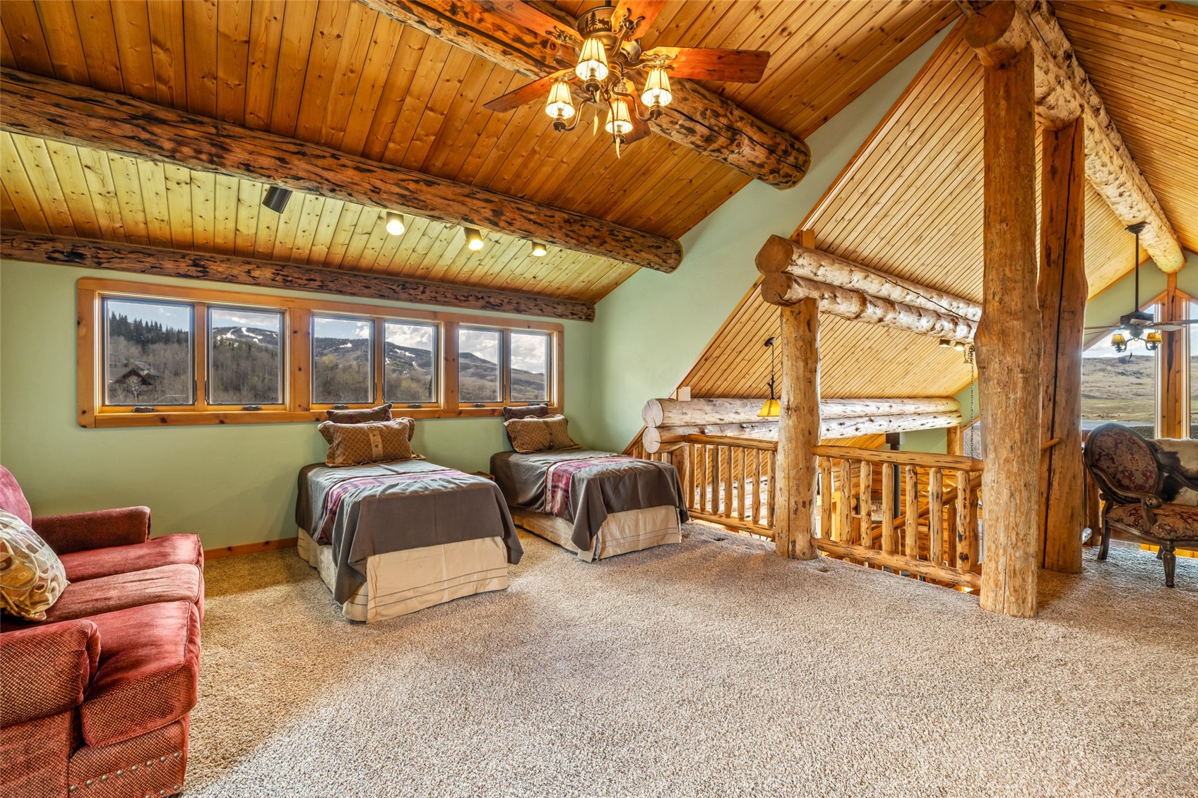 24110 Arapahoe Road Oak Creek, CO 80467 - Photo 25 of 39 a bedroom with furniture and a large window
