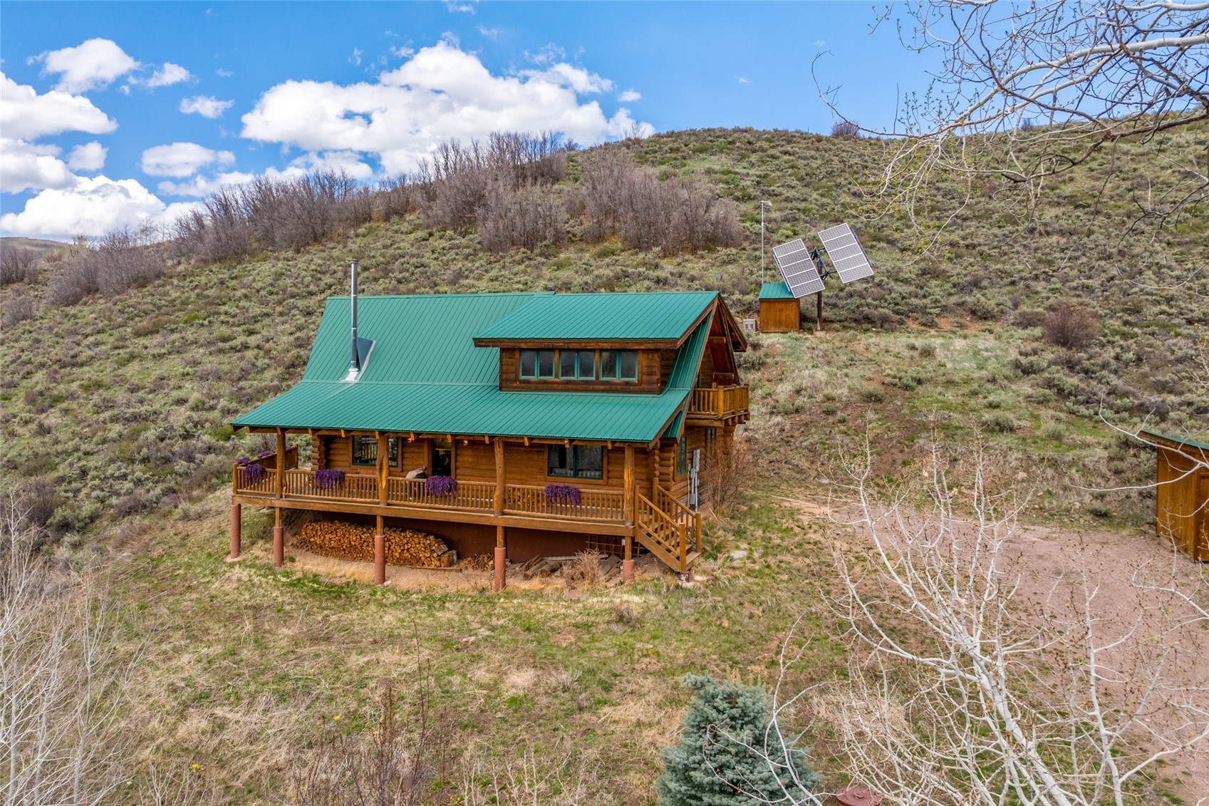 24110 Arapahoe Road Oak Creek, CO 80467 - Photo 33 of 39 a view of a wooden chairs and a table in the patio