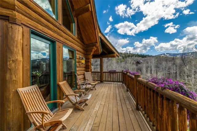 a view of balcony with wooden floor and outdoor seating