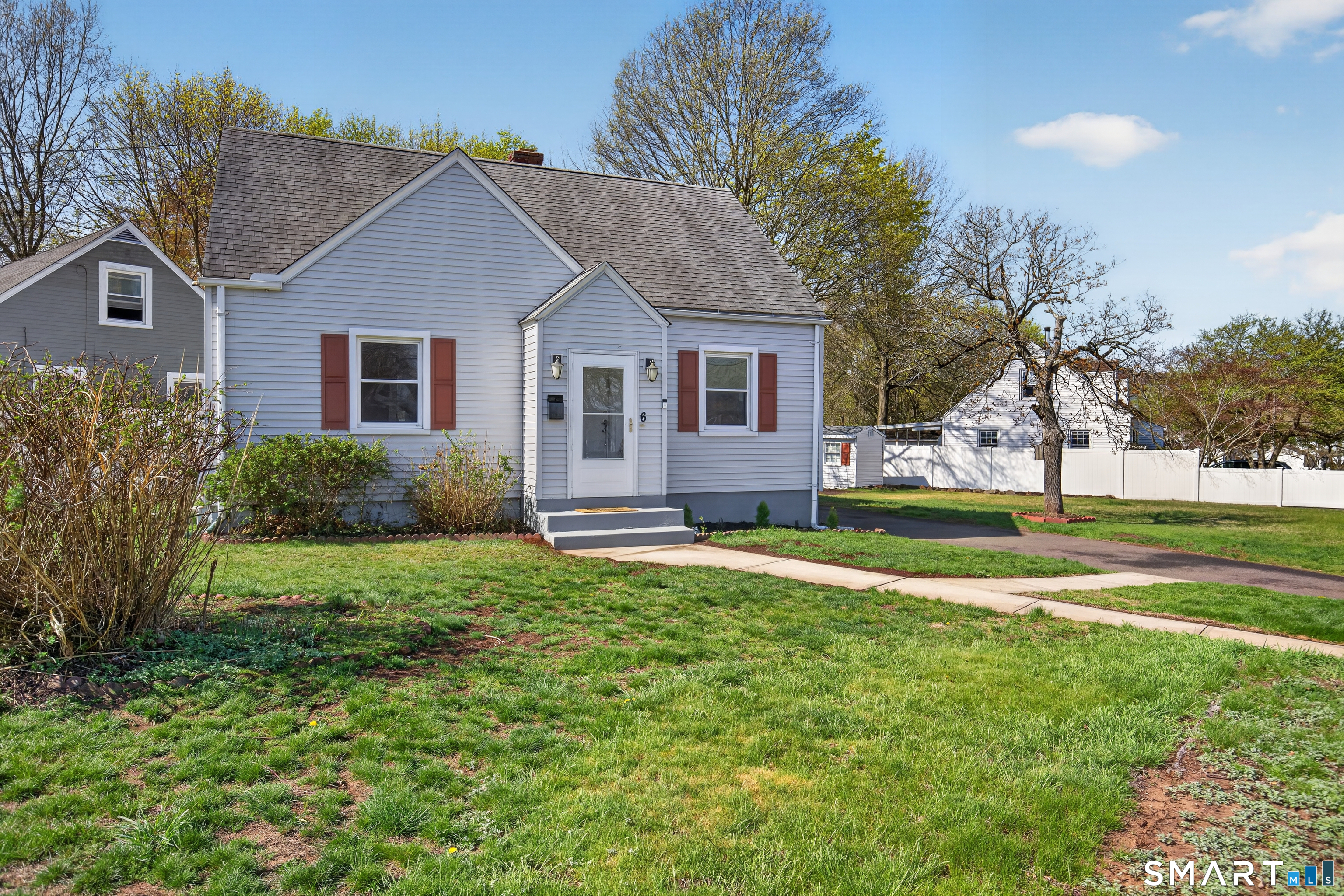 a view of a house with a yard and plants