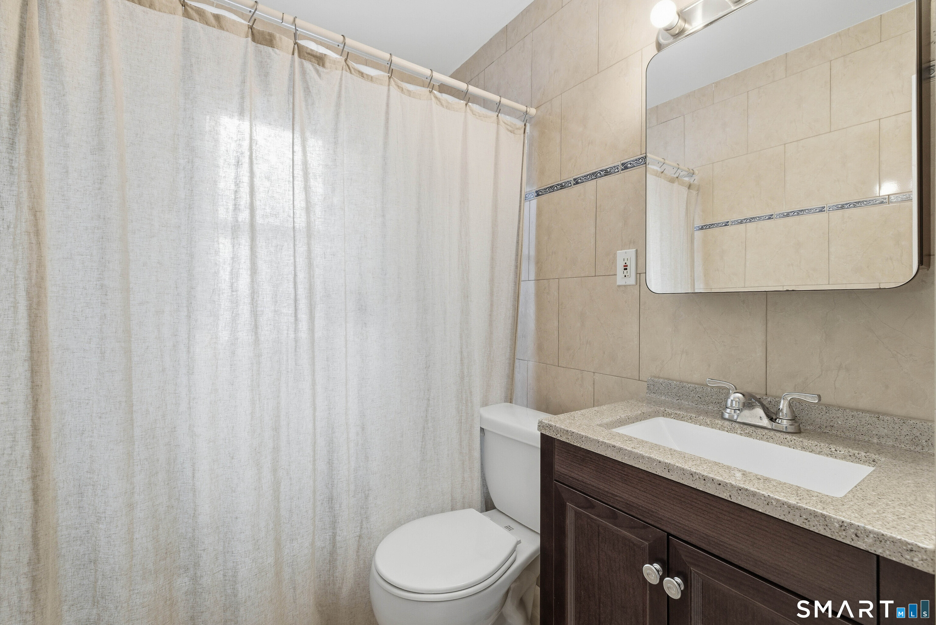6 Welch Street Hamden, CT 06514 - Photo 14 of 23 a bathroom with a granite countertop sink a toilet and shower