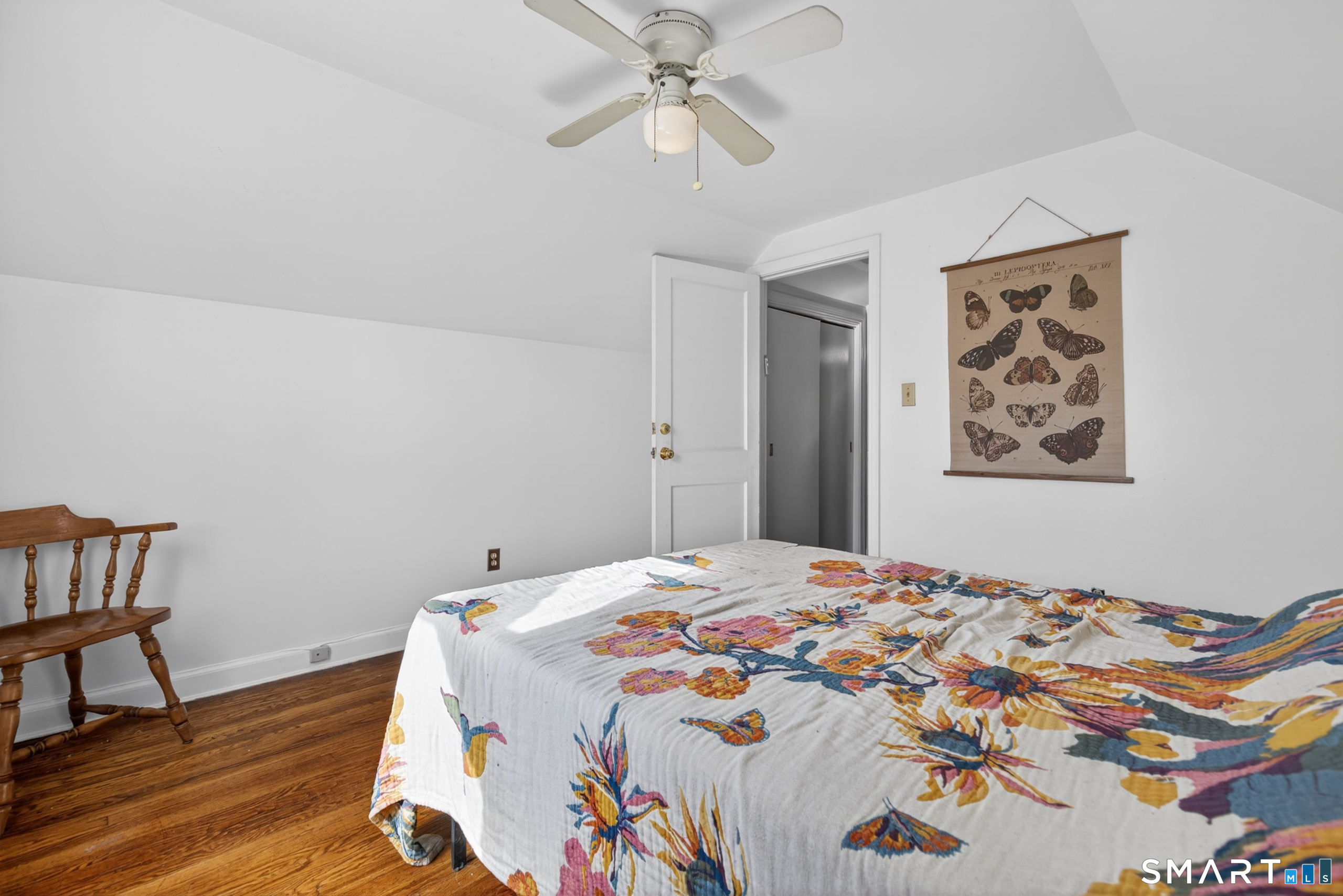 6 Welch Street Hamden, CT 06514 - Photo 17 of 23 a bedroom with a bed and a chandelier