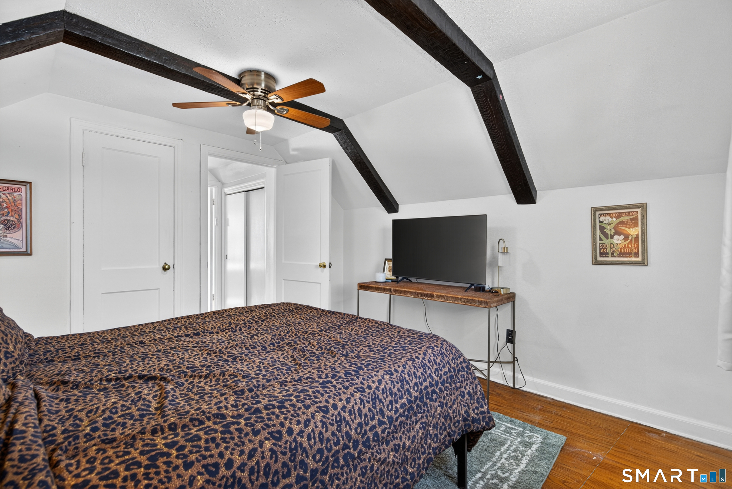 6 Welch Street Hamden, CT 06514 - Photo 18 of 23 a bedroom with a bed and a flat screen tv