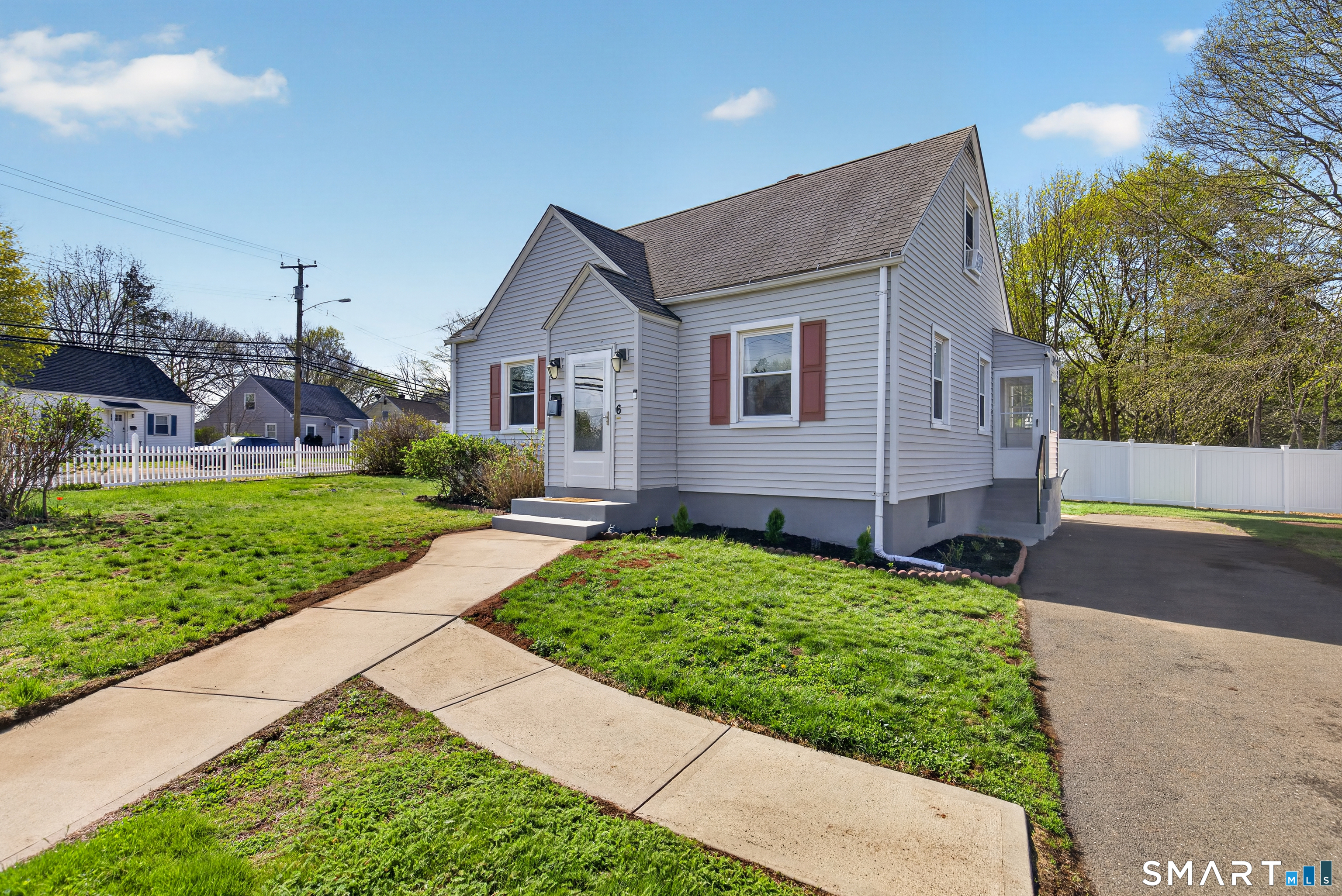 6 Welch Street Hamden, CT 06514 - Photo 2 of 23 a front view of a house with a yard