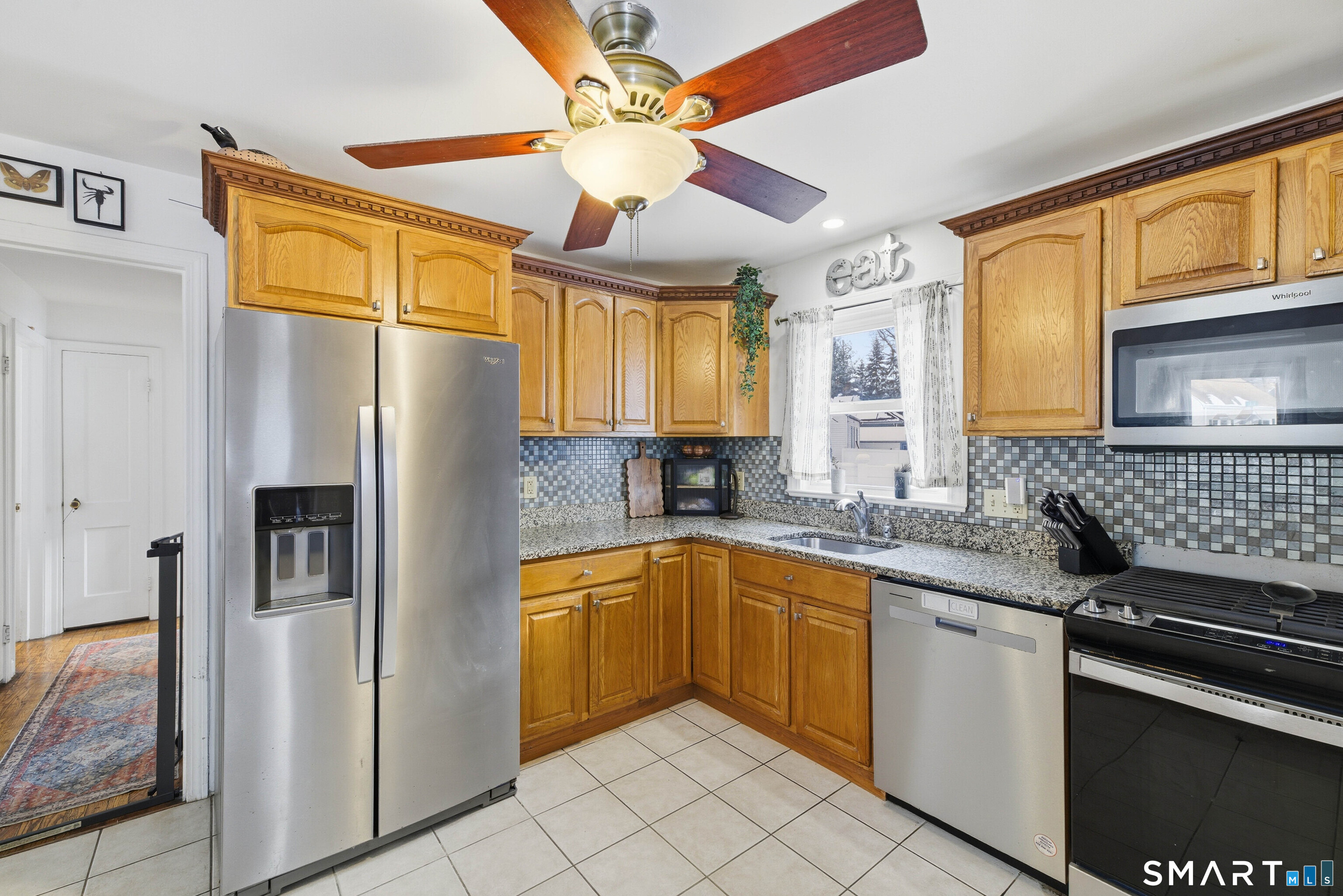 6 Welch Street Hamden, CT 06514 - Photo 4 of 23 a kitchen with stainless steel appliances granite countertop a refrigerator a sink and dishwasher
