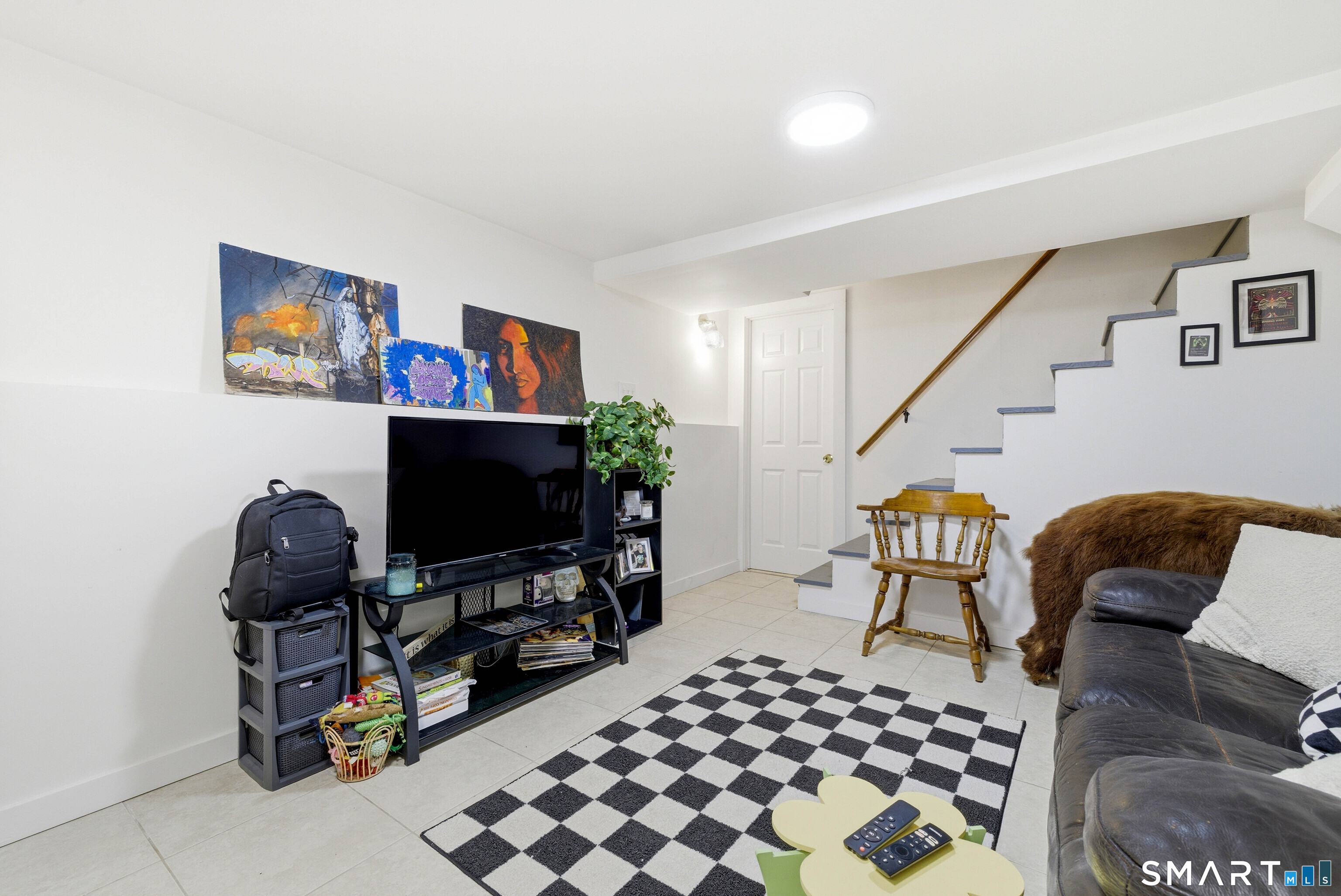 6 Welch Street Hamden, CT 06514 - Photo 7 of 23 a living room with furniture and a flat screen tv