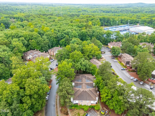 an aerial view of a house with yard