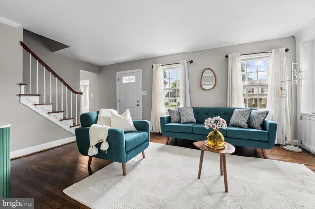a living room with furniture and a rug