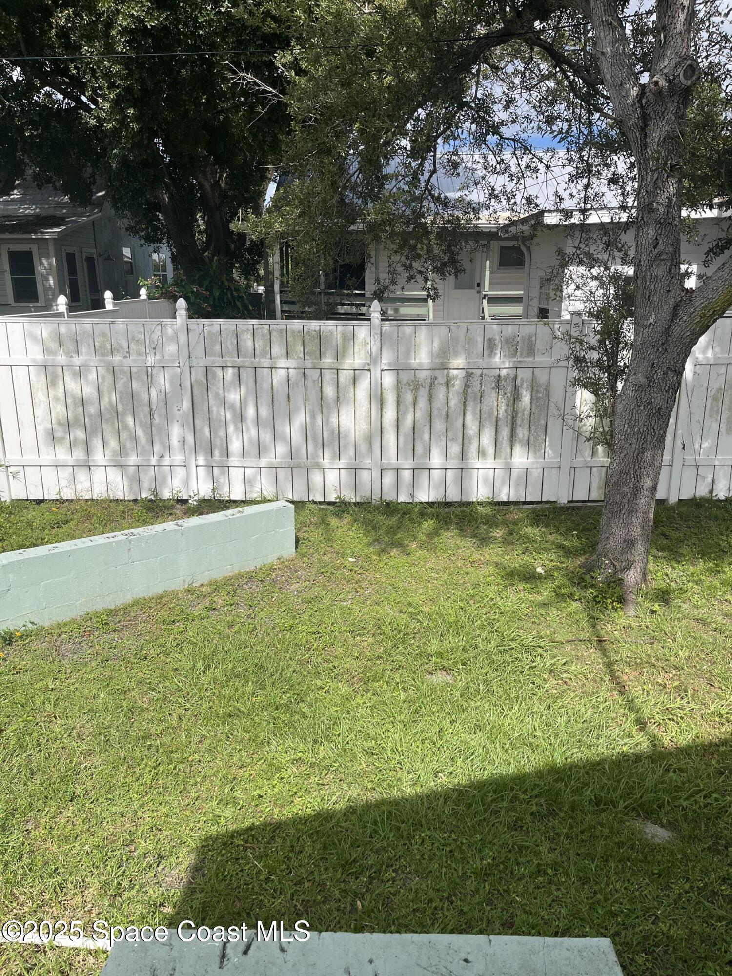 510 East Strawbridge Avenue, Unit BSALON Melbourne, FL 32901 - Photo 11 of 11 a view of a backyard with a garden