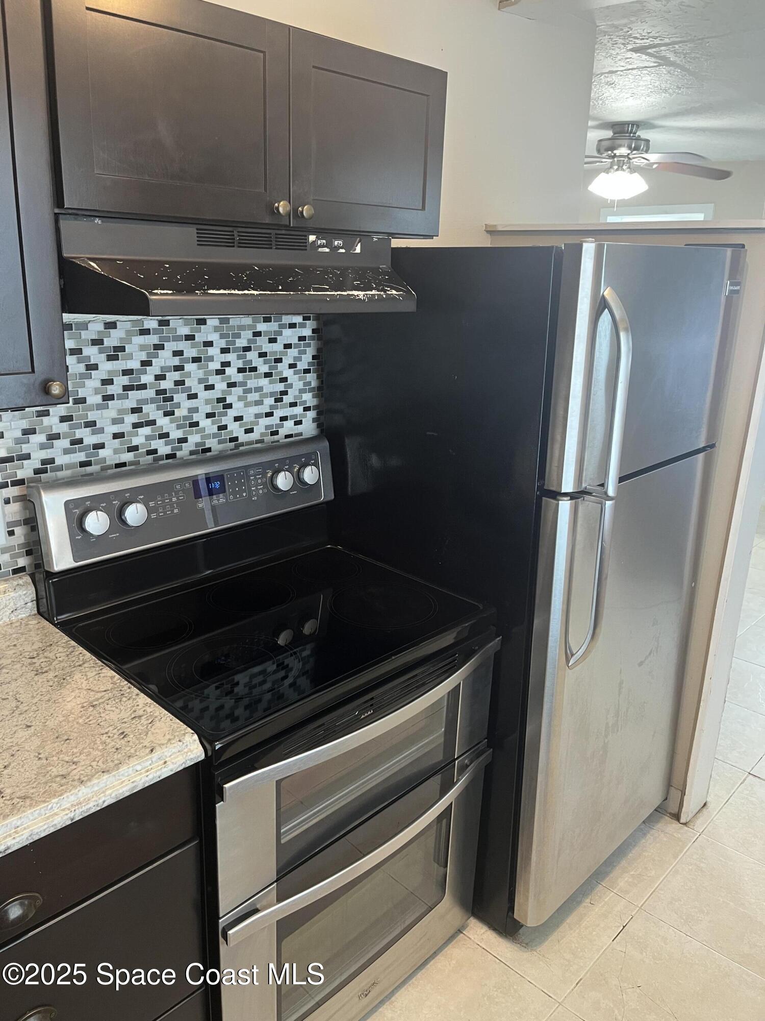510 East Strawbridge Avenue, Unit BSALON Melbourne, FL 32901 - Photo 5 of 11 a close view of a stove kitchen and microwave