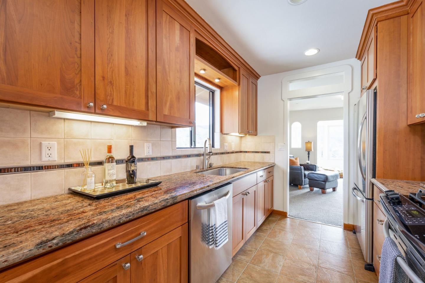 1079 Park Pacifica Avenue Pacifica, CA 94044 - Photo 14 of 43 a kitchen with stainless steel appliances granite countertop a sink stove and cabinets