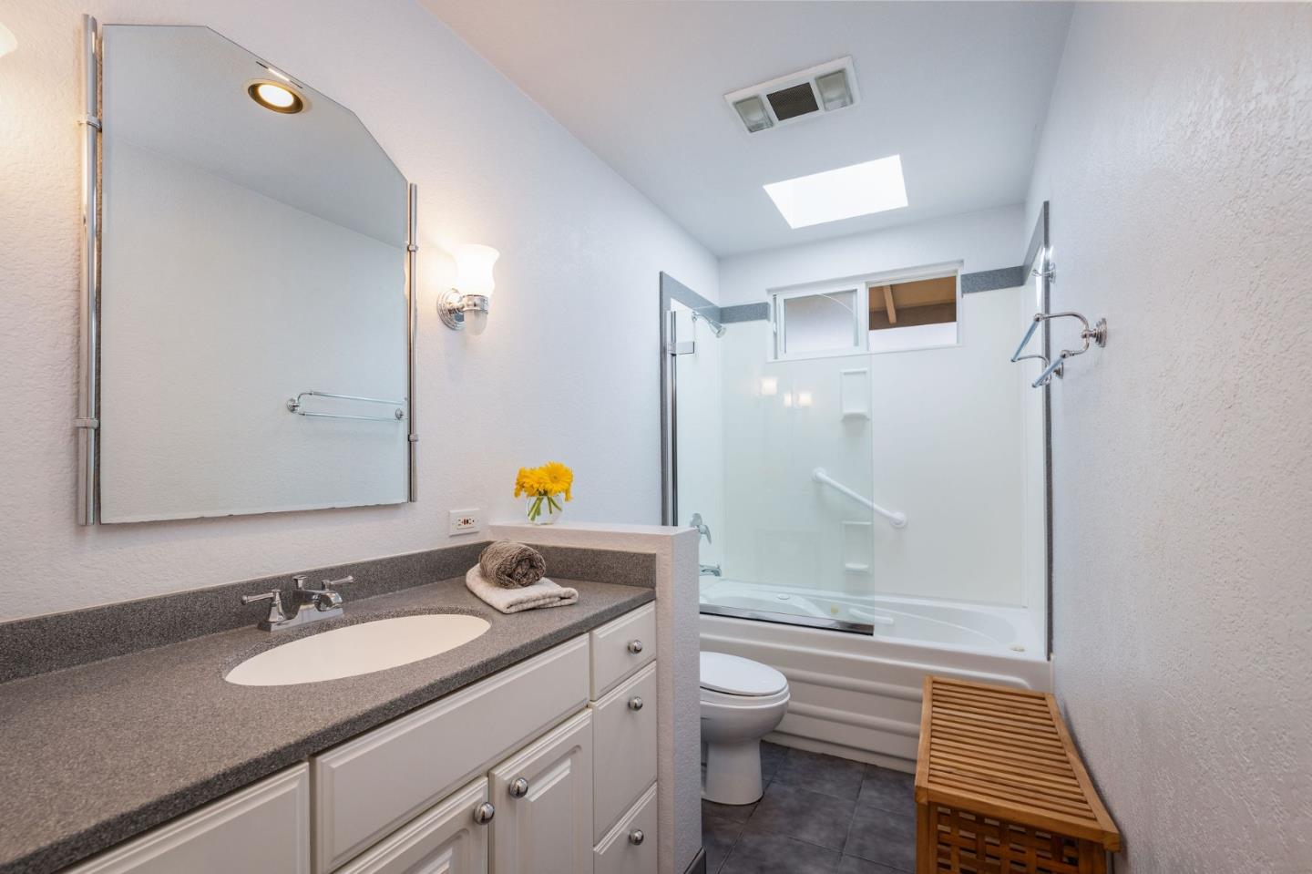 1079 Park Pacifica Avenue Pacifica, CA 94044 - Photo 23 of 43 a bathroom with a sink and a mirror