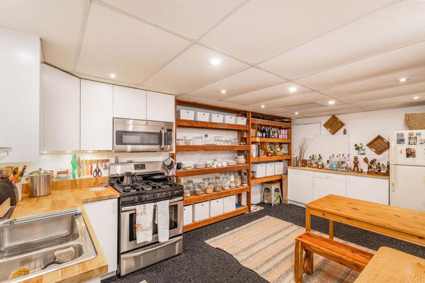1079 Park Pacifica Avenue Pacifica, CA 94044 - Photo 33 of 43 a kitchen with stainless steel appliances granite countertop a stove and cabinets