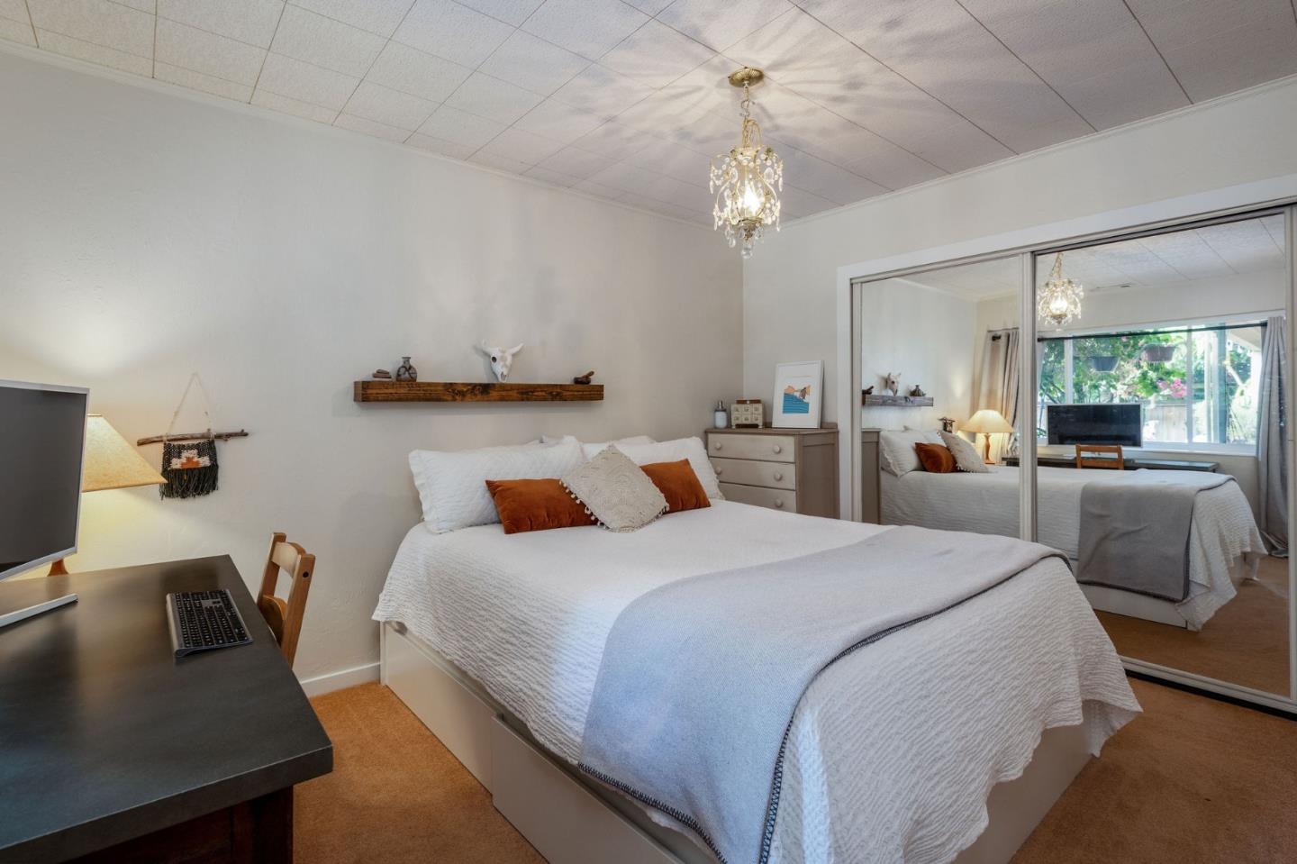 1079 Park Pacifica Avenue Pacifica, CA 94044 - Photo 34 of 43 a bedroom with a bed and a desk