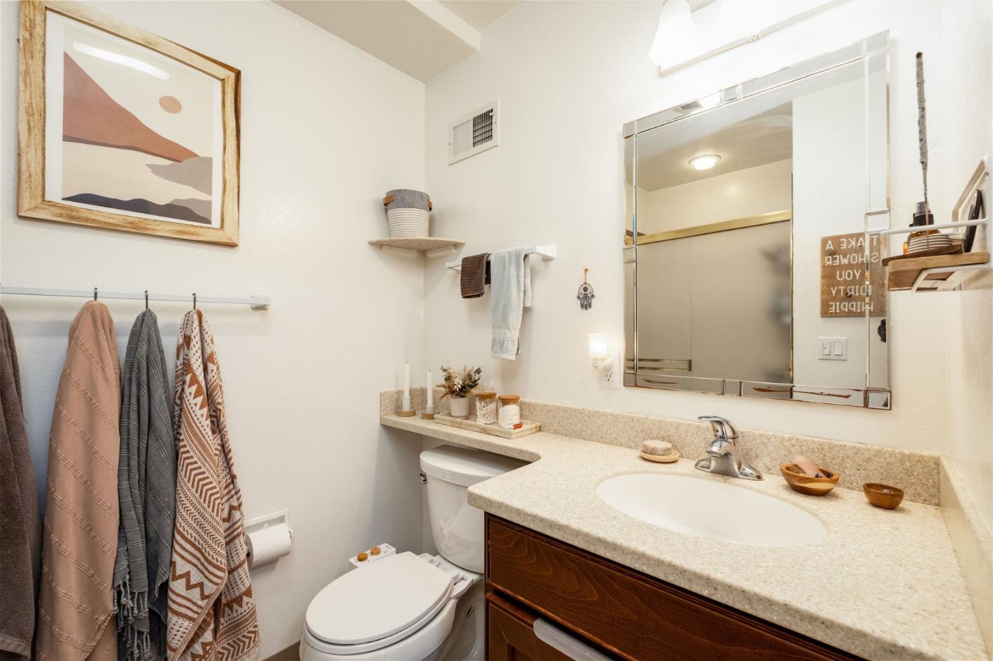 1079 Park Pacifica Avenue Pacifica, CA 94044 - Photo 36 of 43 a bathroom with a sink vanity mirror and toilet