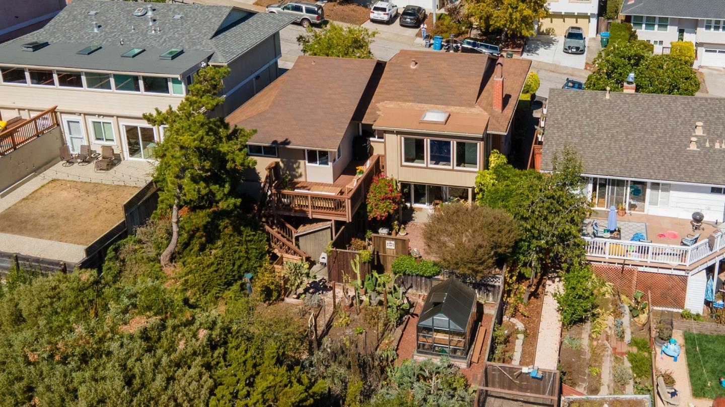 1079 Park Pacifica Avenue Pacifica, CA 94044 - Photo 39 of 43 an aerial view of a house with a yard and sitting area