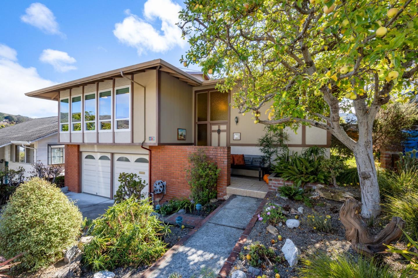 1079 Park Pacifica Avenue Pacifica, CA 94044 - Photo 5 of 43 a view of a house with a yard