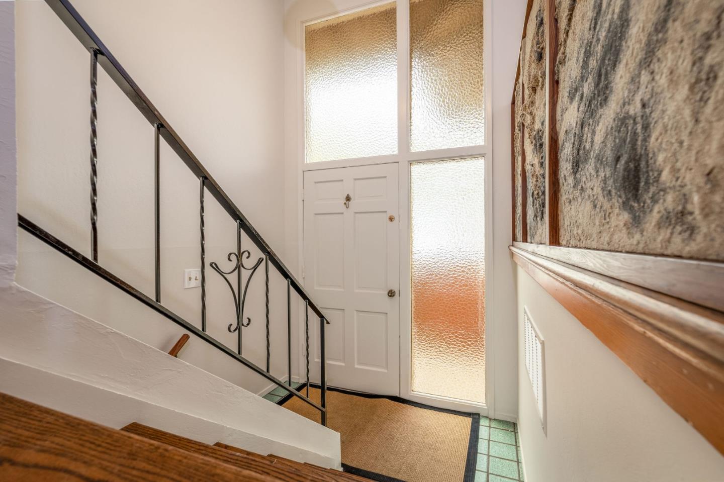 1079 Park Pacifica Avenue Pacifica, CA 94044 - Photo 6 of 43 a view of staircase with wooden floor and stairs