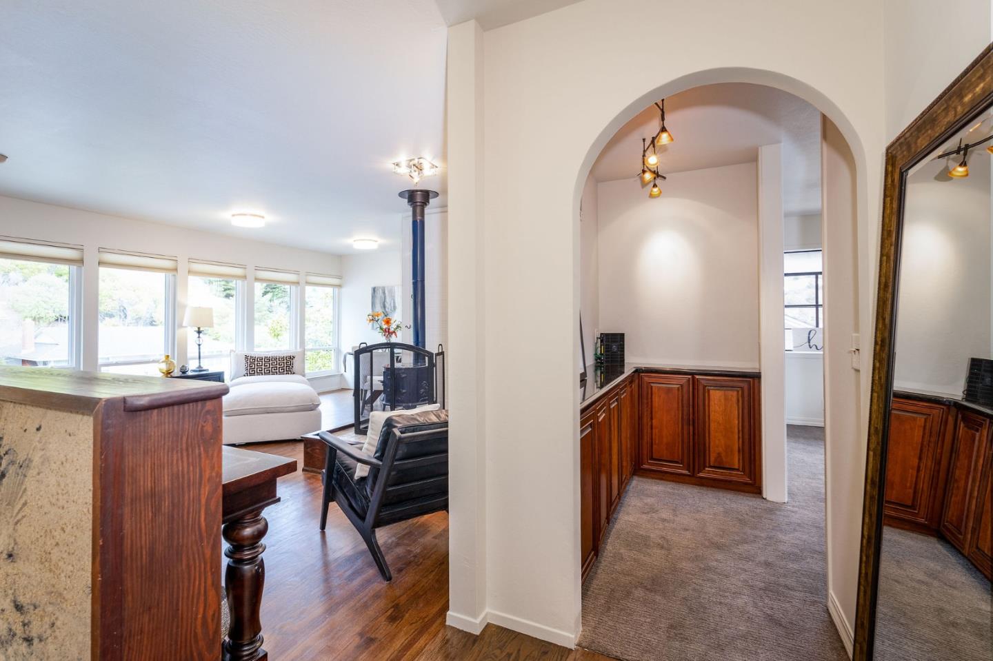 1079 Park Pacifica Avenue Pacifica, CA 94044 - Photo 8 of 43 a view of kitchen and dining area with chandelier