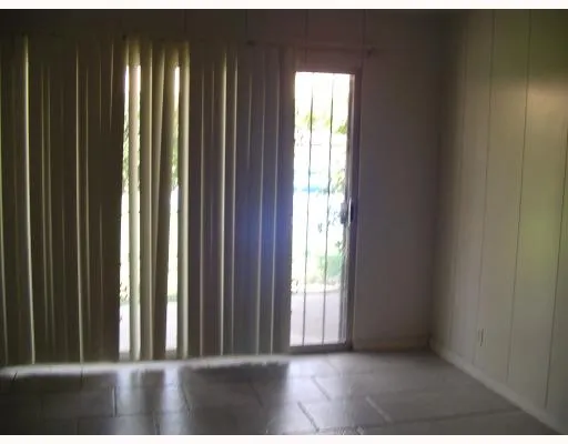 a view of a closet area with floor to ceiling window