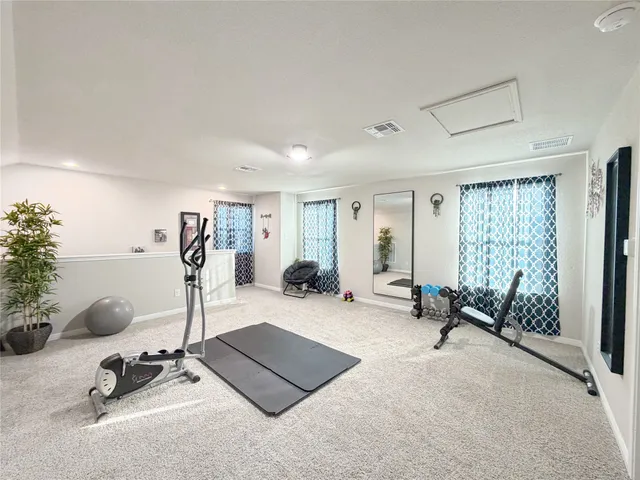 a view of a room with gym equipment