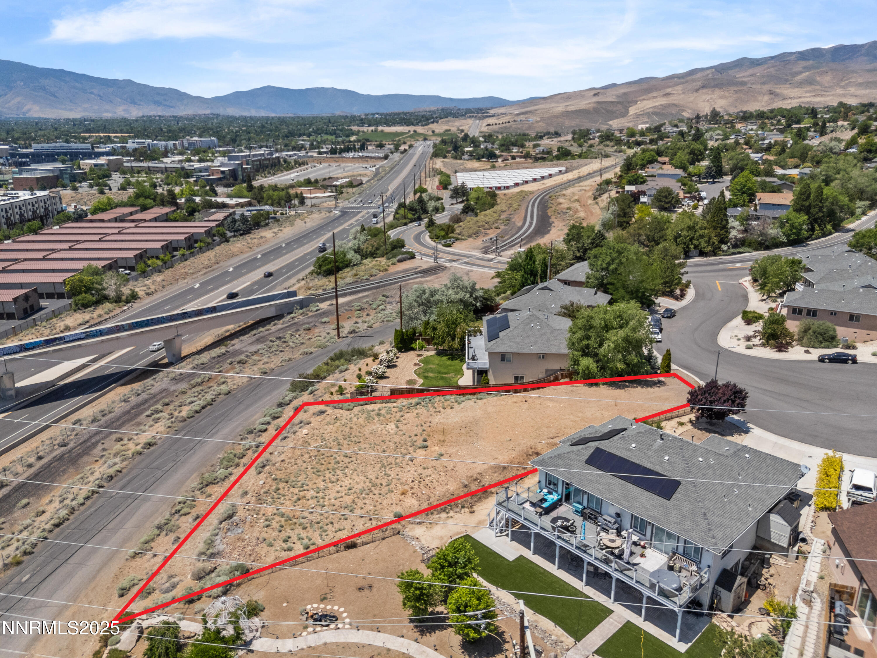 970 Demos Court Reno, NV 89512 - Photo 24 of 26 an aerial view of a city with mountain