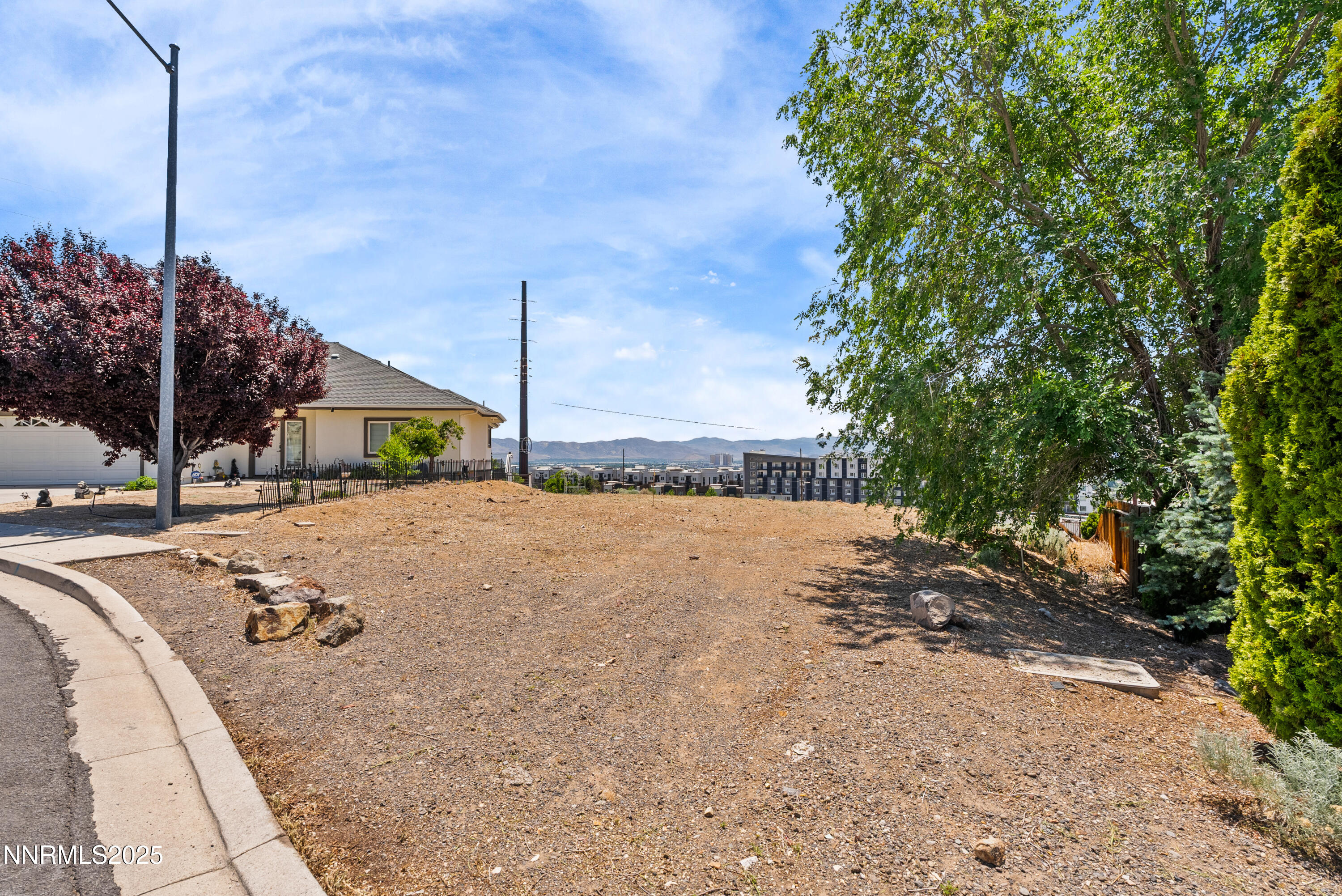 970 Demos Court Reno, NV 89512 - Photo 3 of 26 a view of a backyard of the house