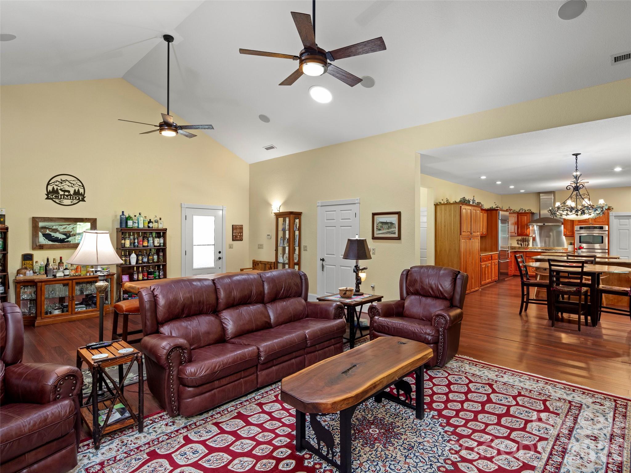 79 Ward Road Maggie Valley, NC 28751 - Photo 12 of 48 a living room with furniture a rug and a chandelier