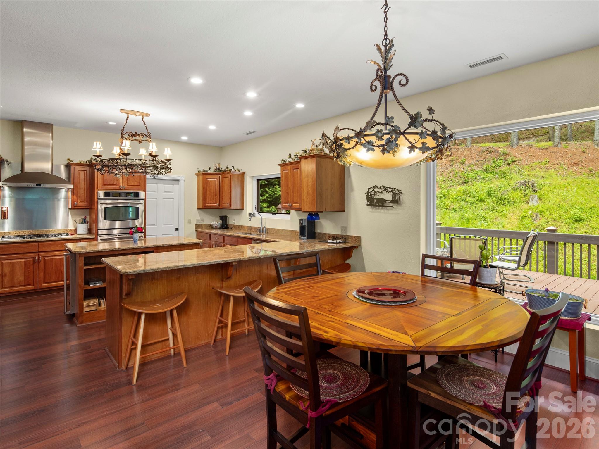 79 Ward Road Maggie Valley, NC 28751 - Photo 14 of 48 a dining room with a table chairs and a table