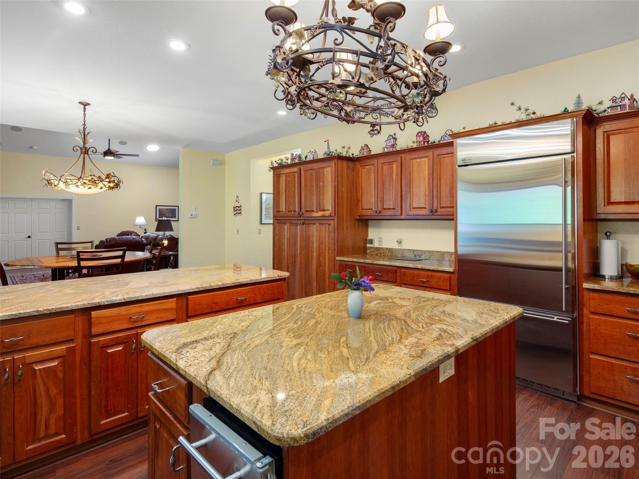 79 Ward Road Maggie Valley, NC 28751 - Photo 19 of 48 a kitchen with kitchen island a counter top space appliances and cabinets