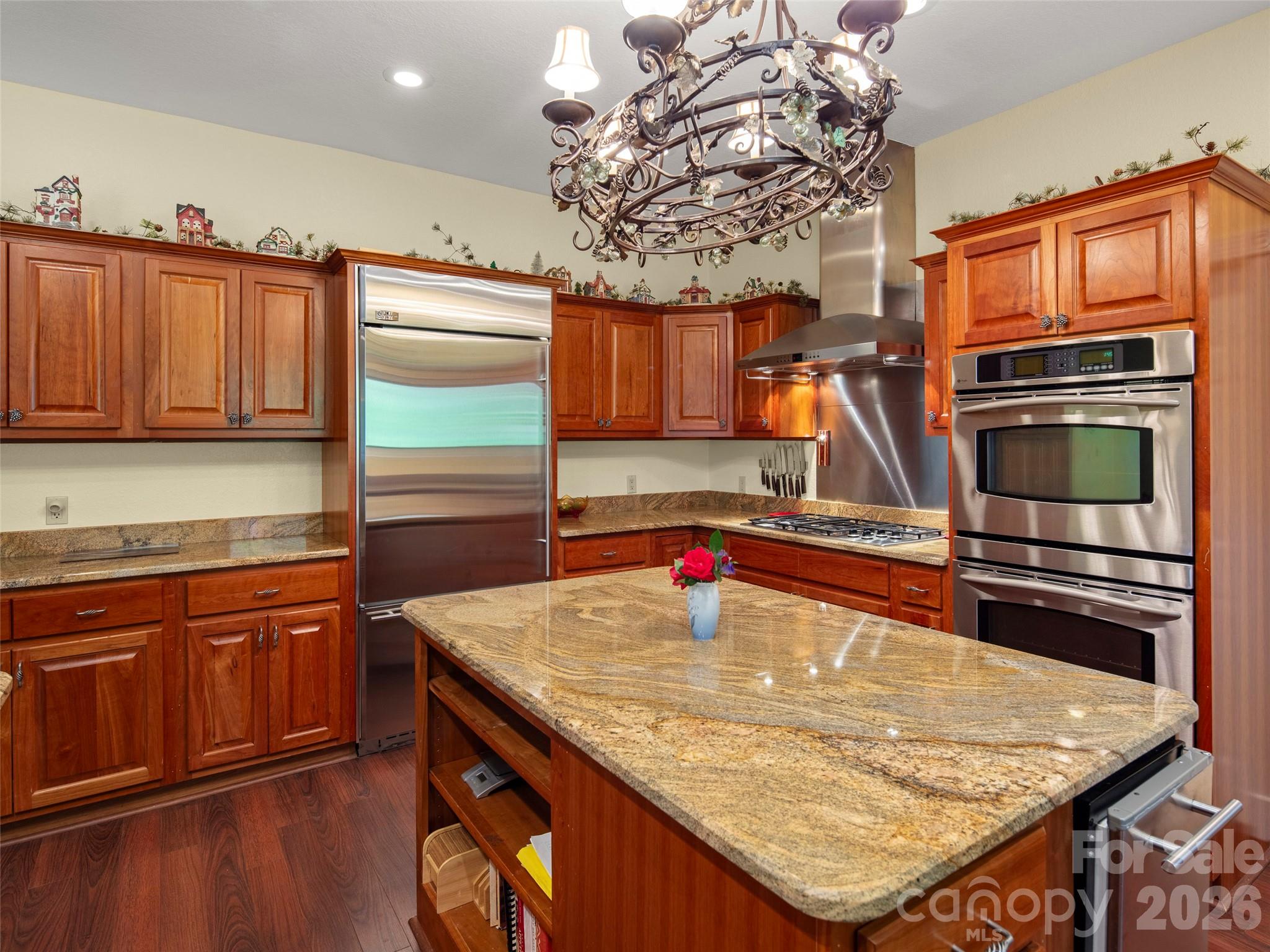 79 Ward Road Maggie Valley, NC 28751 - Photo 20 of 48 a kitchen with stainless steel appliances granite countertop a sink refrigerator and microwave