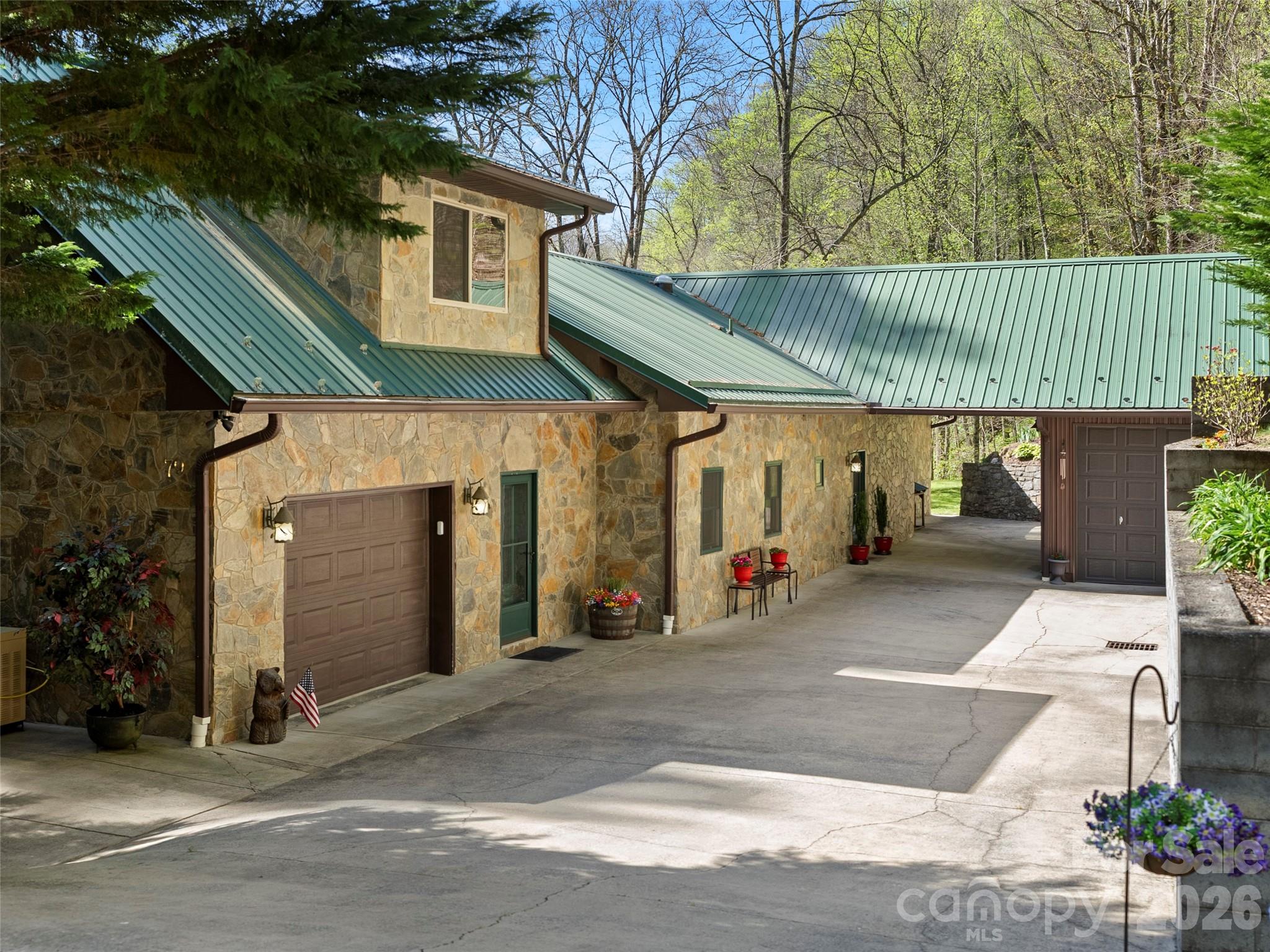 79 Ward Road Maggie Valley, NC 28751 - Photo 2 of 48 a front view of a house with a garage