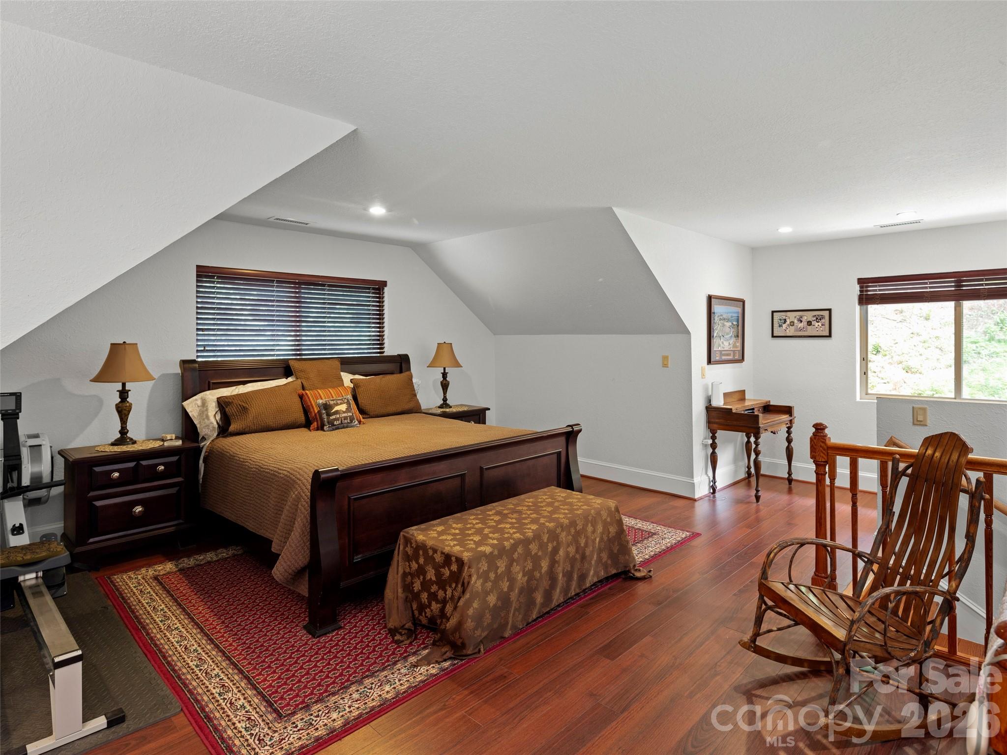 79 Ward Road Maggie Valley, NC 28751 - Photo 23 of 48 a bedroom with furniture and wooden floor