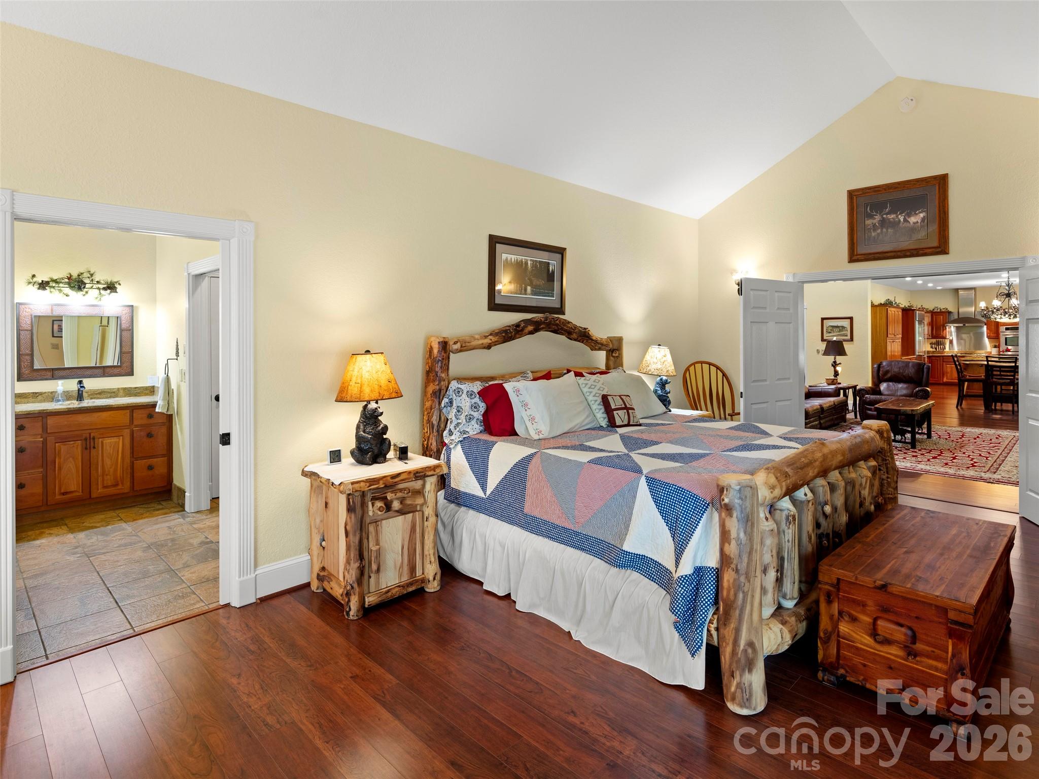 79 Ward Road Maggie Valley, NC 28751 - Photo 26 of 48 a bedroom with a bed and wooden floor