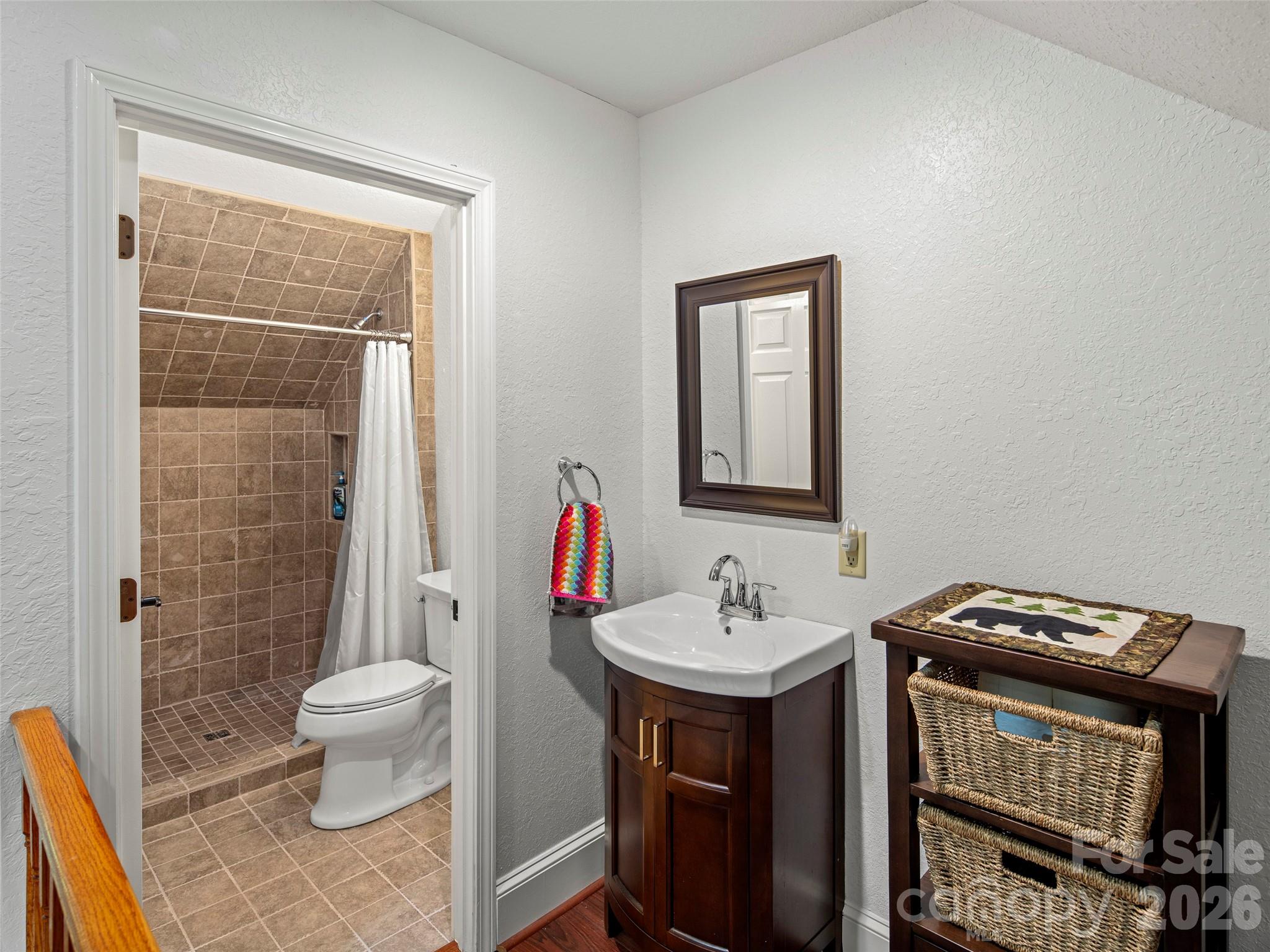 79 Ward Road Maggie Valley, NC 28751 - Photo 30 of 48 a bathroom with a sink toilet and shower