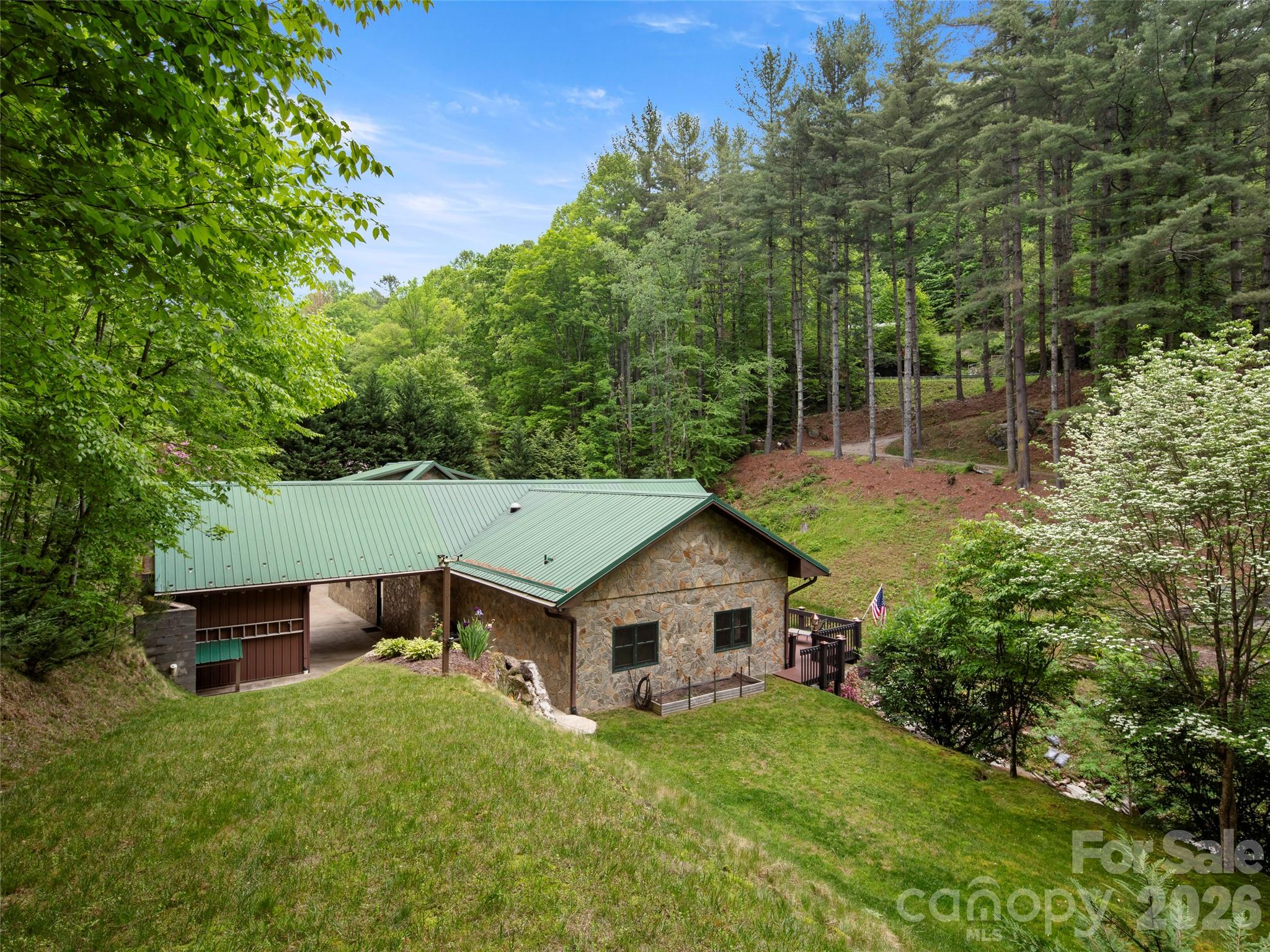 79 Ward Road Maggie Valley, NC 28751 - Photo 3 of 48 front view of a house with a yard