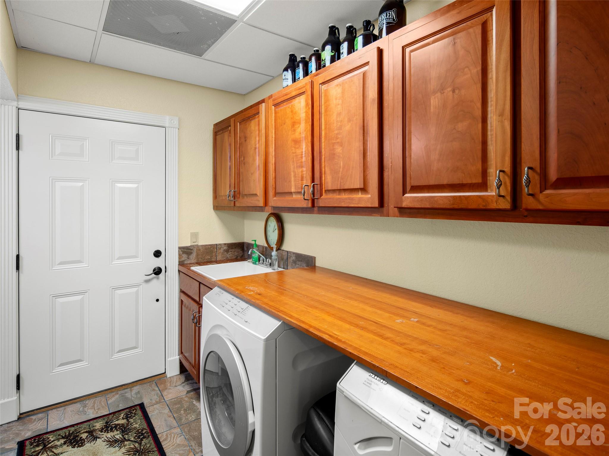 79 Ward Road Maggie Valley, NC 28751 - Photo 31 of 48 a view of a storage and utility room with washer and dryer