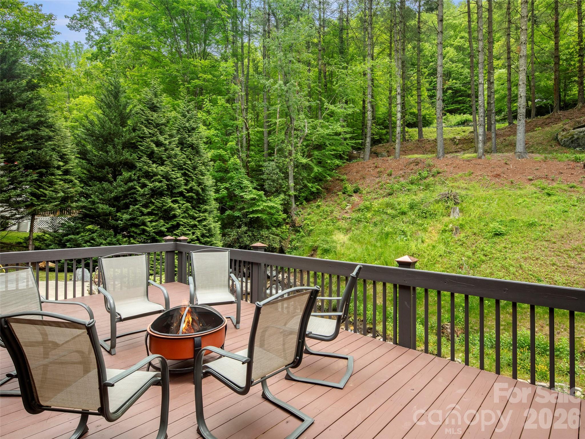 79 Ward Road Maggie Valley, NC 28751 - Photo 35 of 48 a view of a wooden deck with chairs