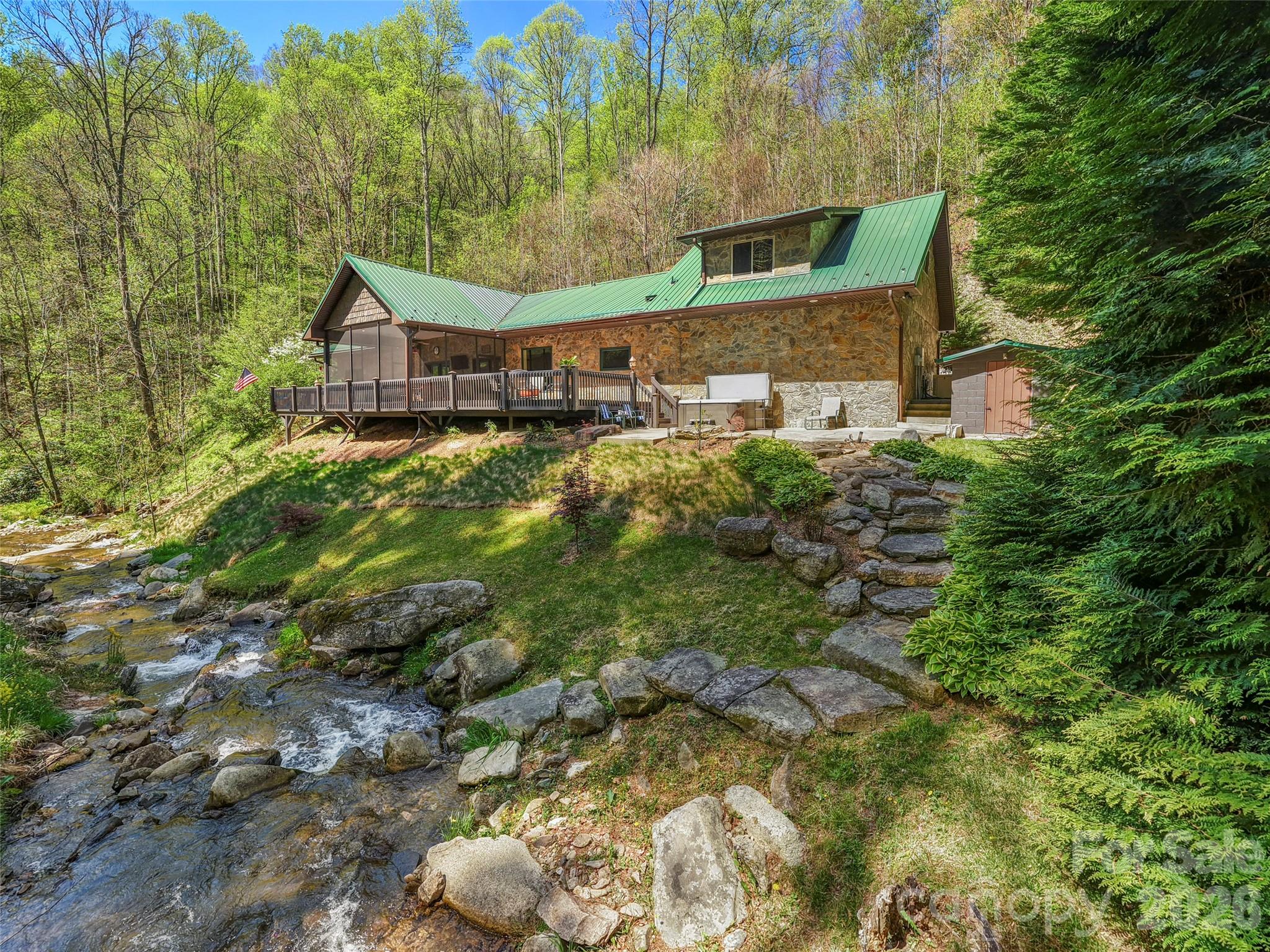 79 Ward Road Maggie Valley, NC 28751 - Photo 37 of 48 a front view of a house with a yard