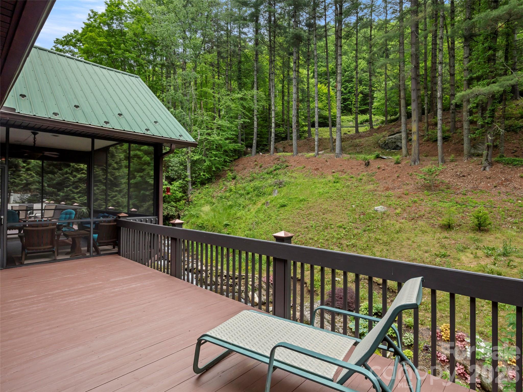79 Ward Road Maggie Valley, NC 28751 - Photo 43 of 48 a view of a two chairs and table in the balcony